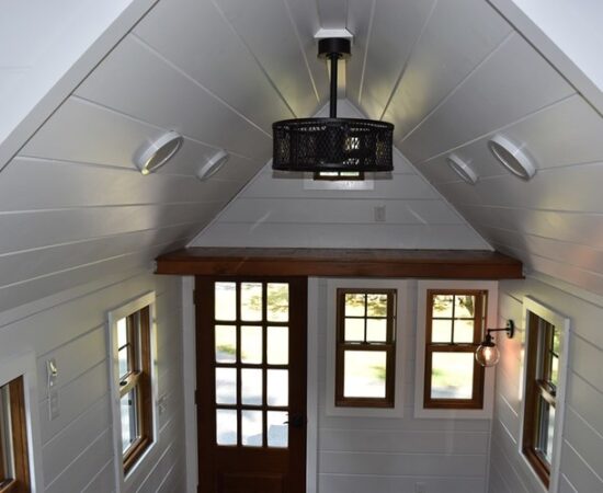 Aerial view showing the loft storage space, multiple ceilings LED lights and ceiling fan light.