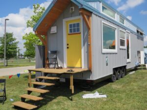 The front door of the macdonald tiny home by fritz tiny homes