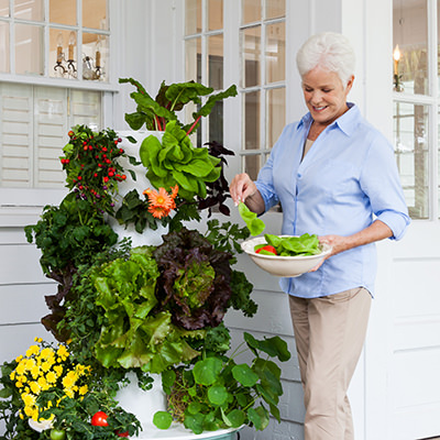 old lady with tower garden 